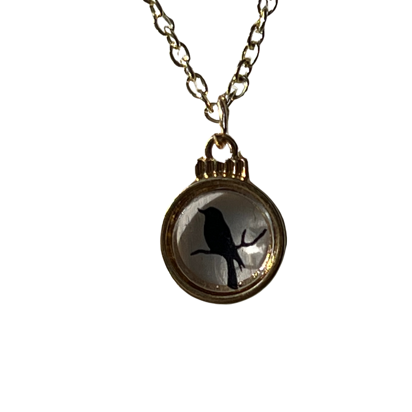 Sparrows Gold Tone Necklace with a Glass Transparent Black Sparrow Pendant