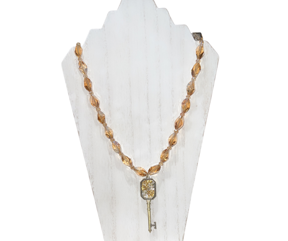 The Key Within the Key Beaded Necklace with a Gold Glass Key Pendant