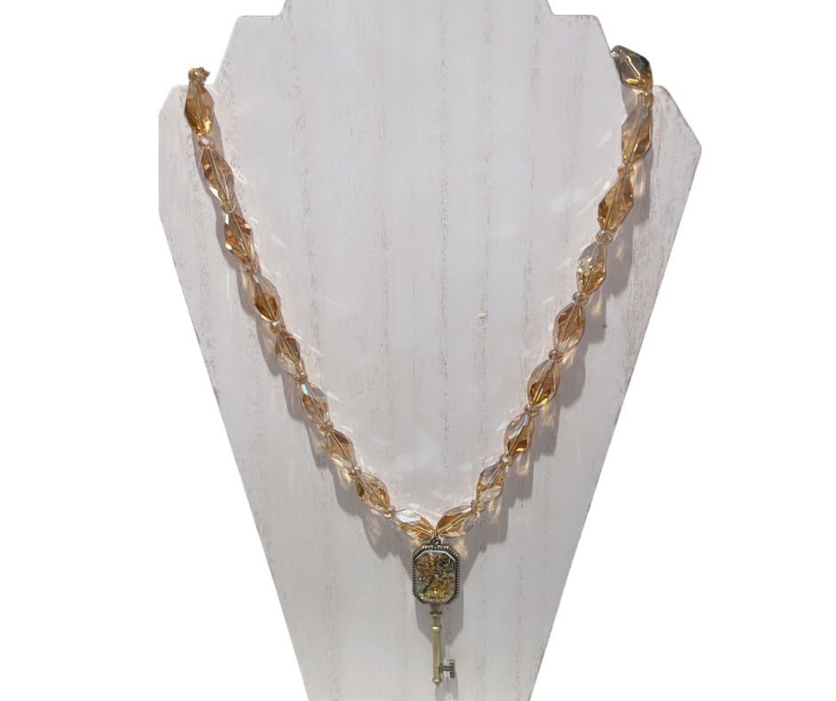 The Key Within the Key Beaded Necklace with a Gold Glass Key Pendant