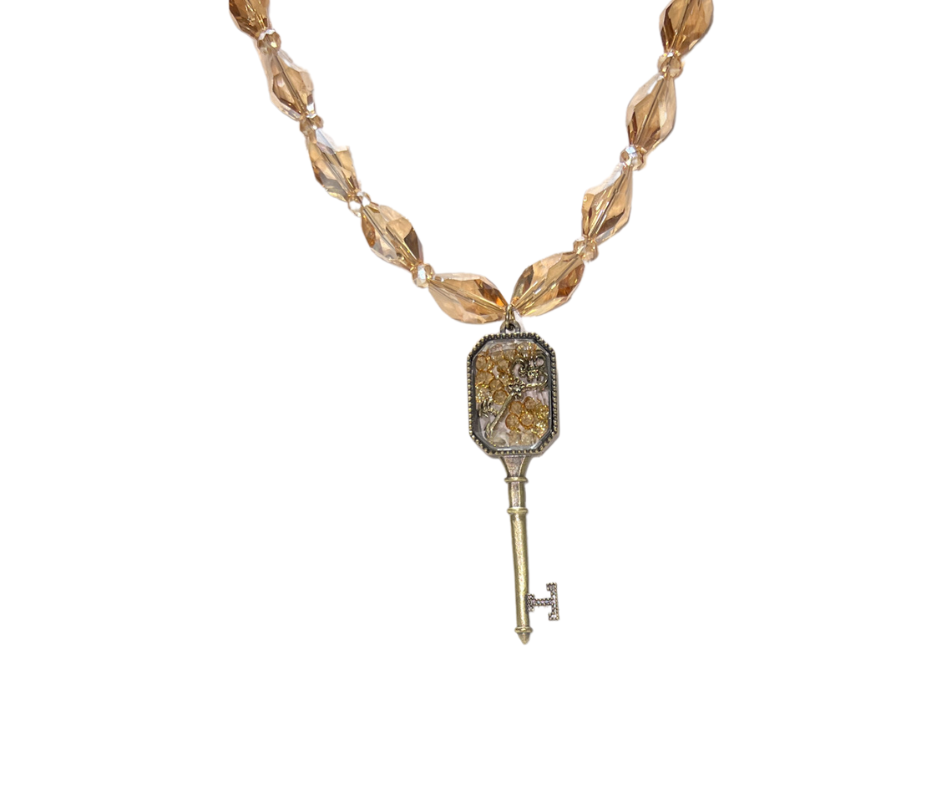 The Key Within the Key Beaded Necklace with a Gold Glass Key Pendant